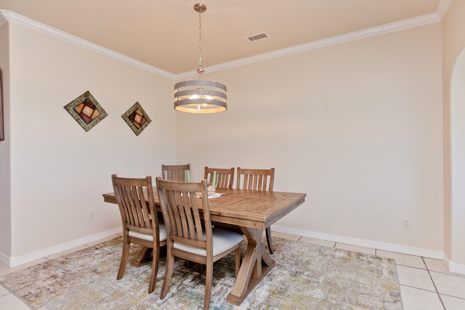 1353 19 Road Fruita, CO 81521 - Photo 12 of 42 a view of a dining room with furniture and chandelier