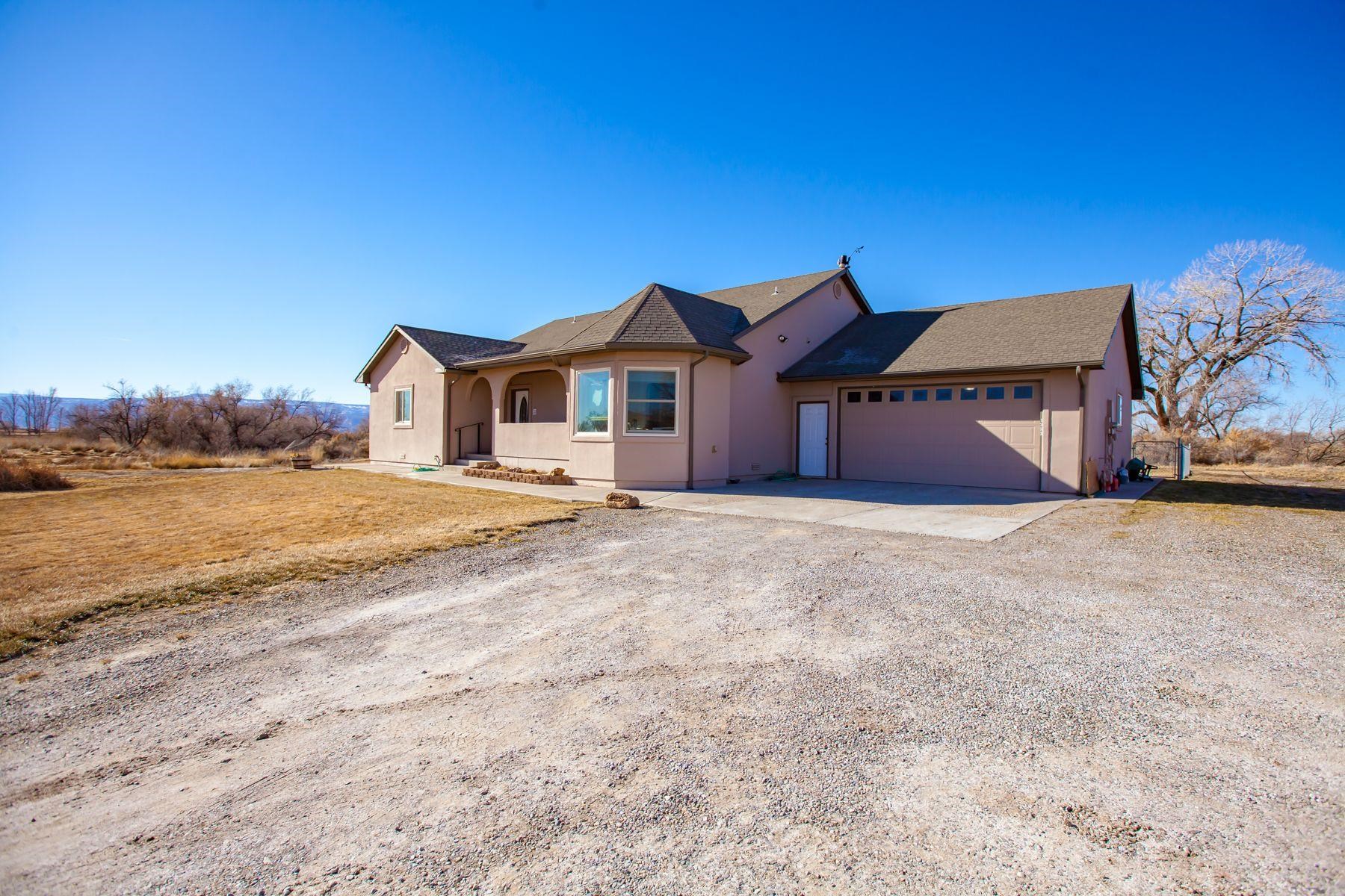 1353 19 Road Fruita, CO 81521 - Photo 2 of 42 a front view of a house with a yard