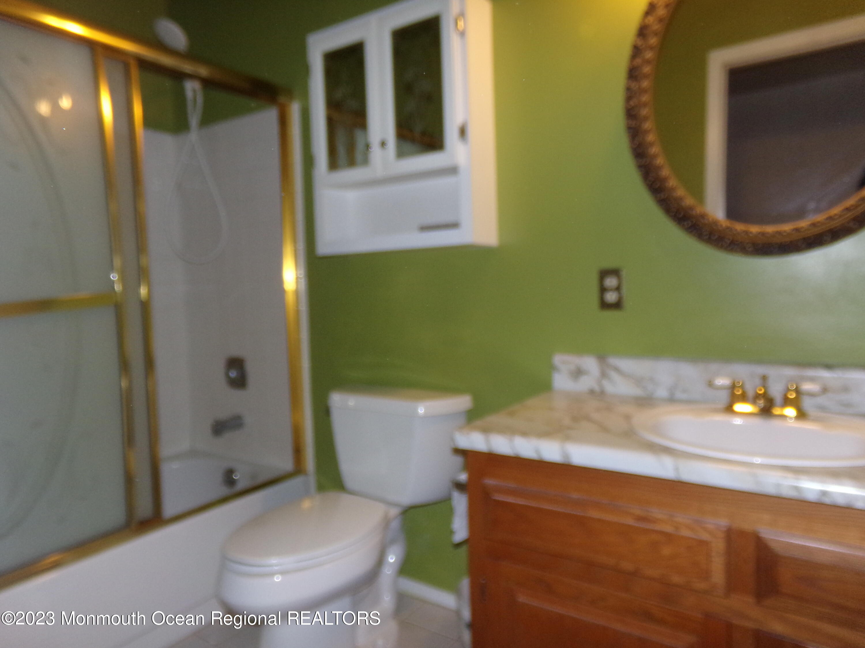 11 Ardmore Street, Unit 61 Whiting, NJ 08759 - Photo 11 of 34 a bathroom with a sink and a mirror
