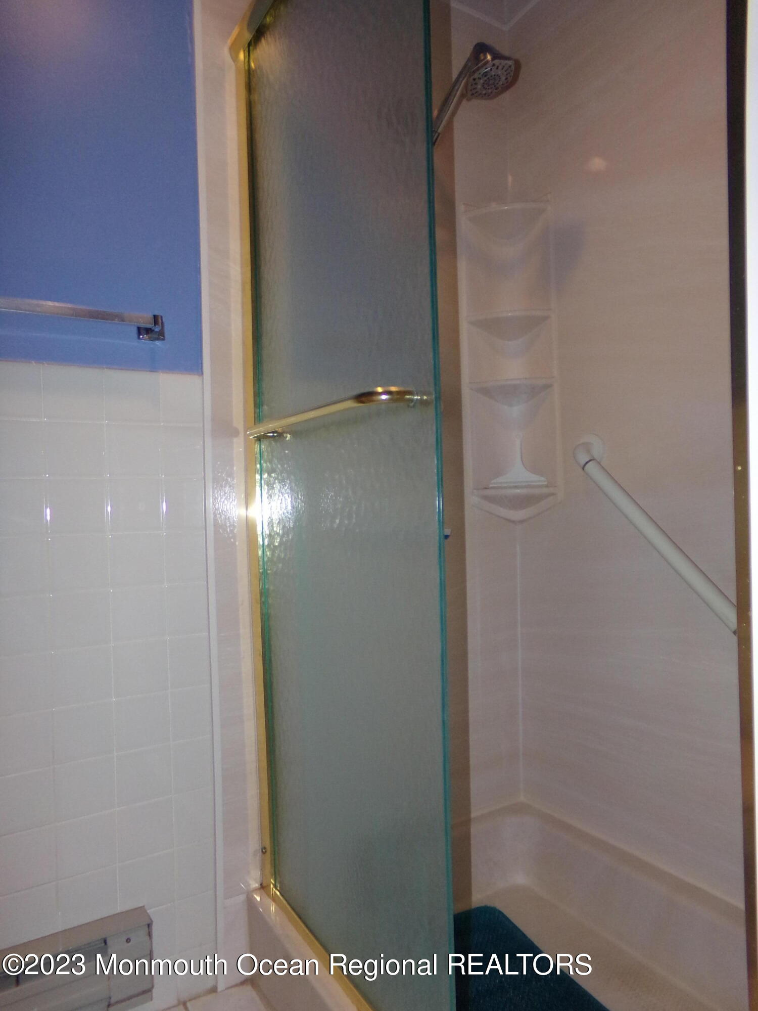 11 Ardmore Street, Unit 61 Whiting, NJ 08759 - Photo 18 of 34 a bathroom with a glass shower door