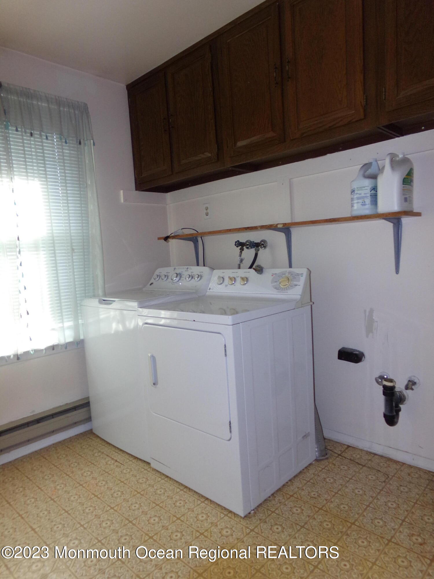 11 Ardmore Street, Unit 61 Whiting, NJ 08759 - Photo 20 of 34 a utility room with cabinets washer and dryer