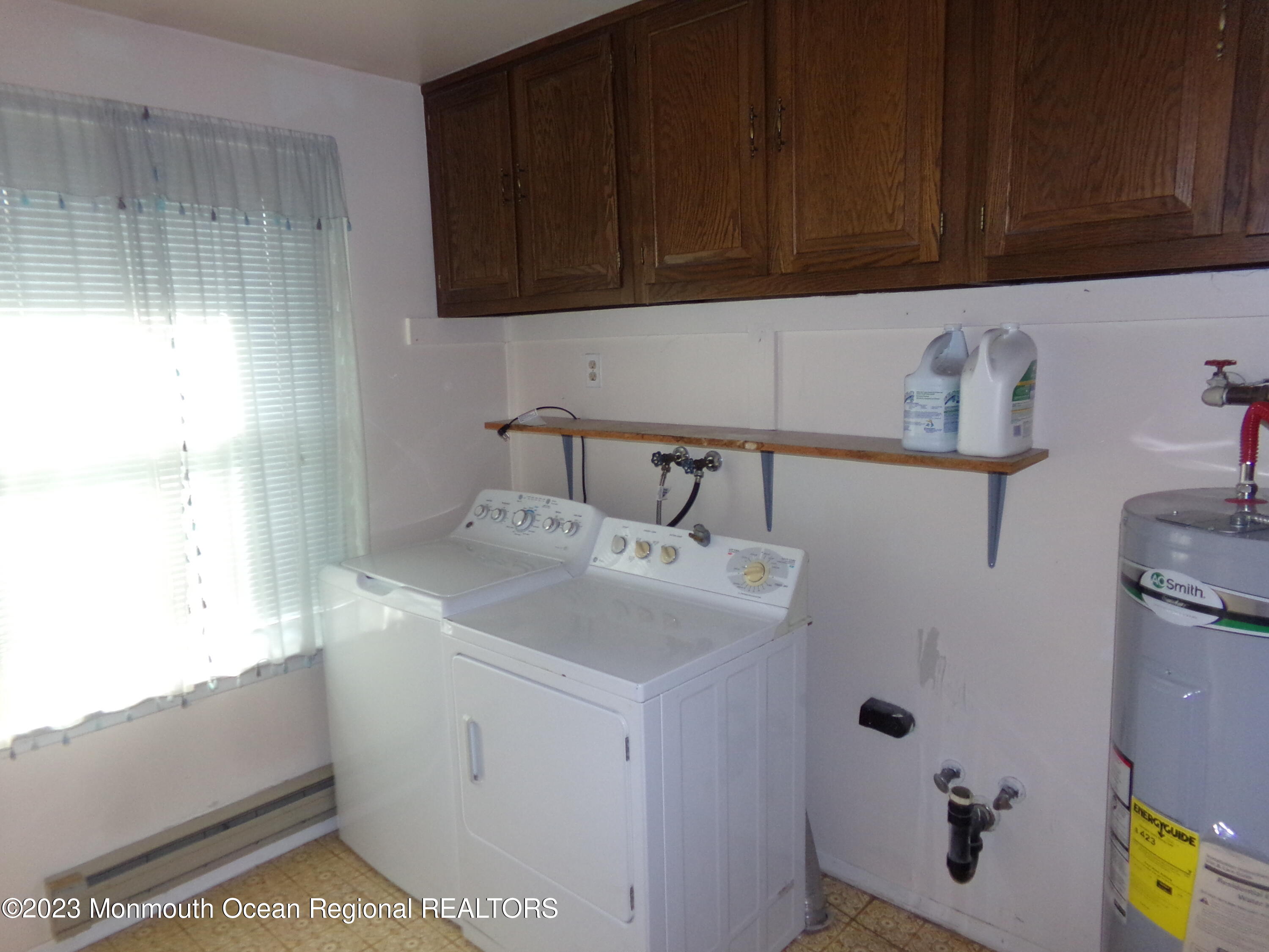 11 Ardmore Street, Unit 61 Whiting, NJ 08759 - Photo 21 of 34 a bathroom with a sink and a shower
