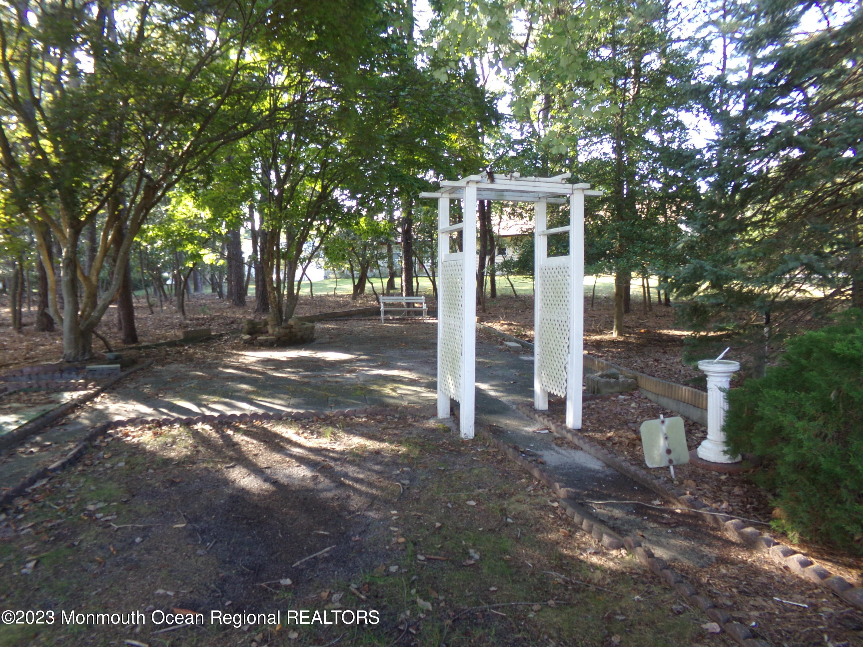 11 Ardmore Street, Unit 61 Whiting, NJ 08759 - Photo 27 of 34 a front view of a house with a yard