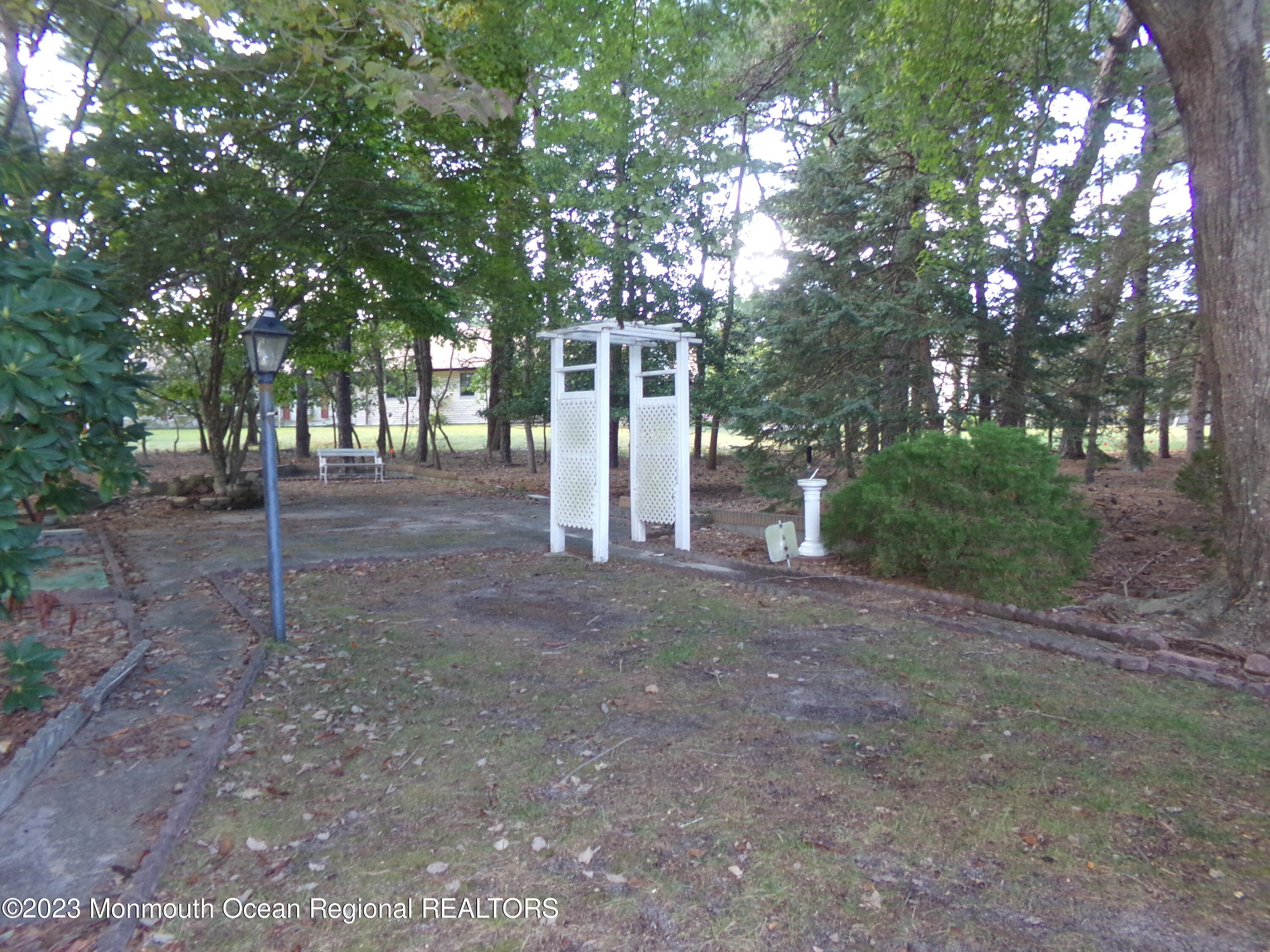 11 Ardmore Street, Unit 61 Whiting, NJ 08759 - Photo 28 of 34 a view of a backyard with large trees