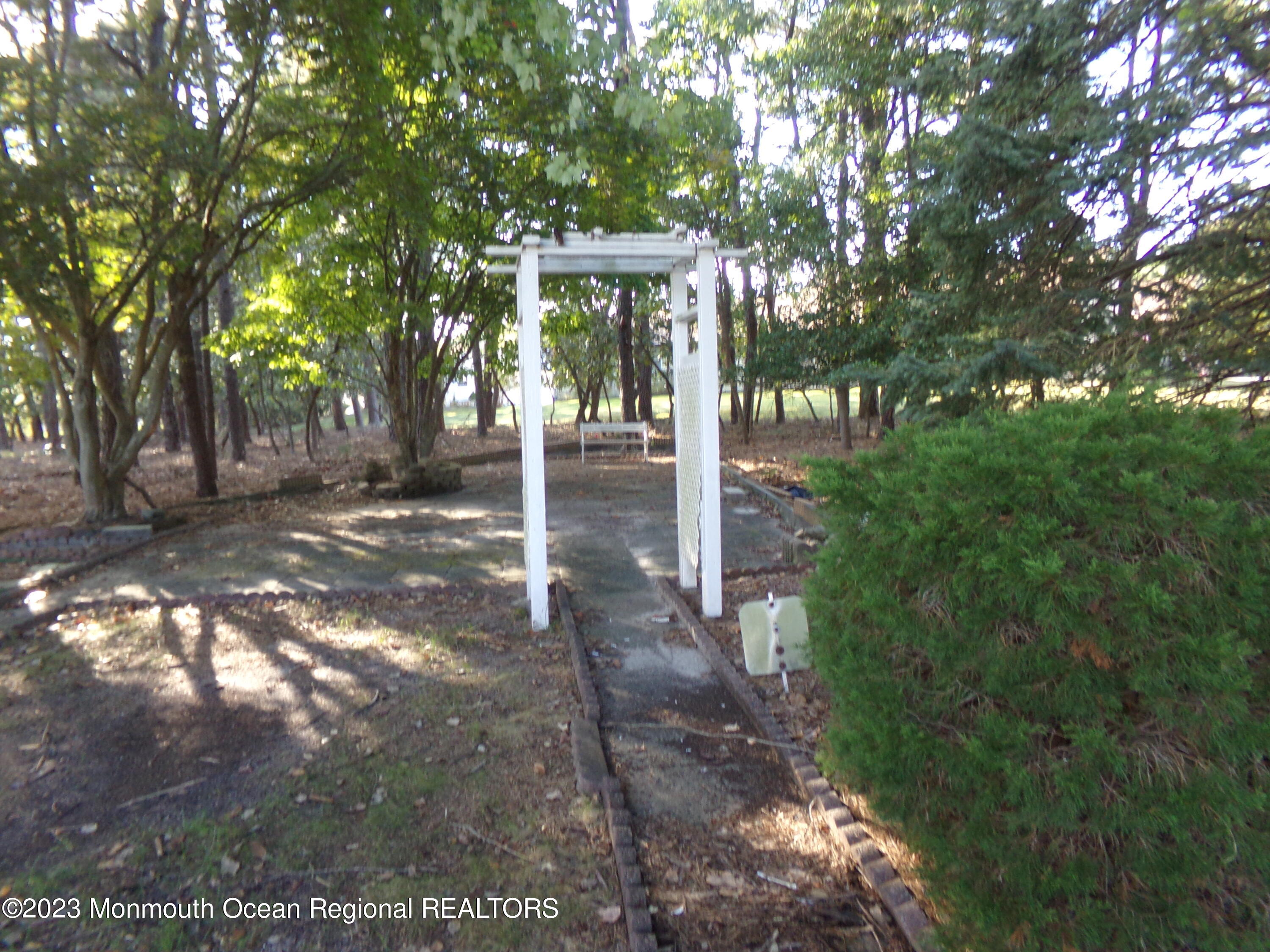 11 Ardmore Street, Unit 61 Whiting, NJ 08759 - Photo 30 of 34 a view of a house with backyard