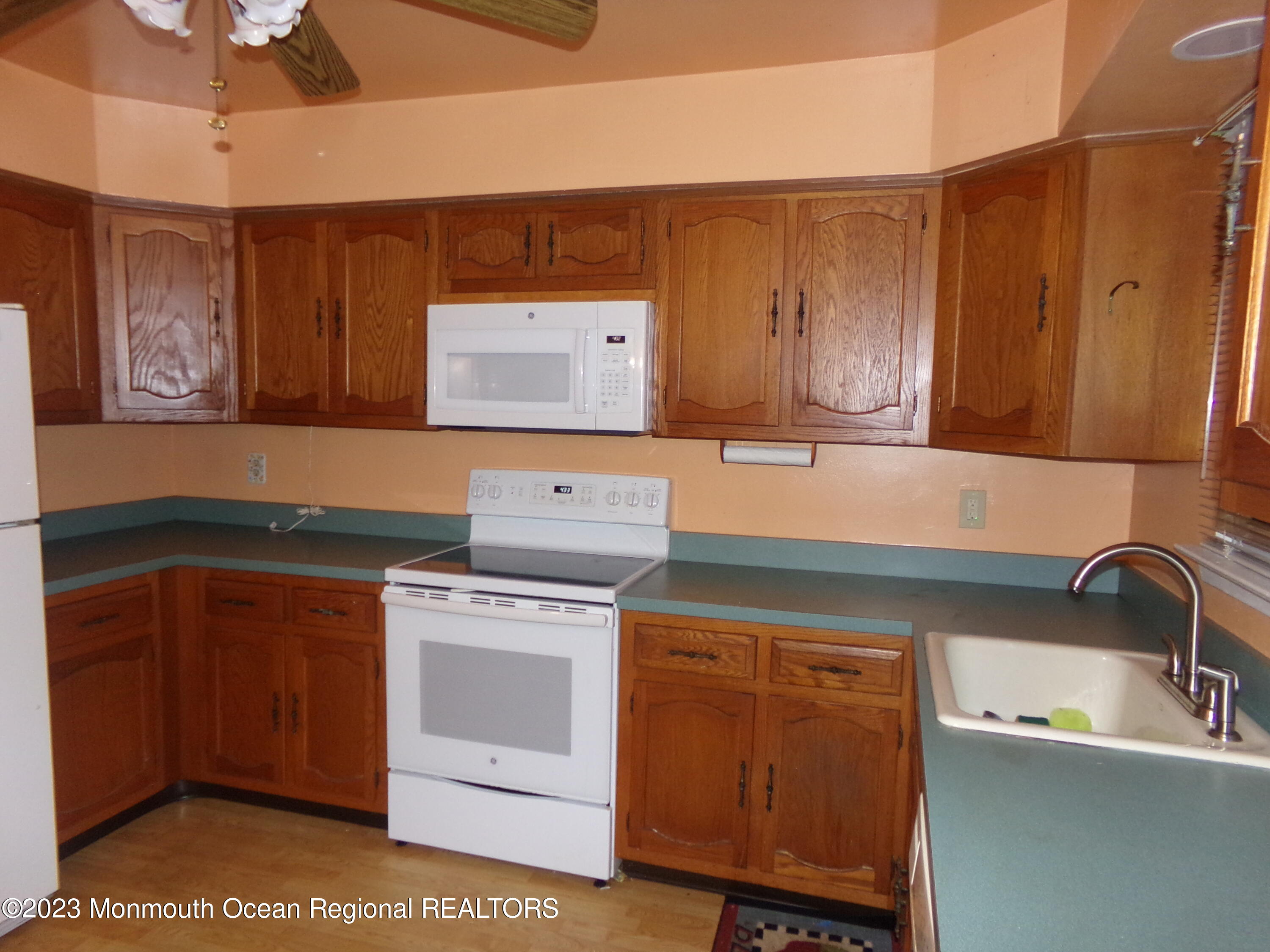 11 Ardmore Street, Unit 61 Whiting, NJ 08759 - Photo 8 of 34 a kitchen with a stove and cabinets