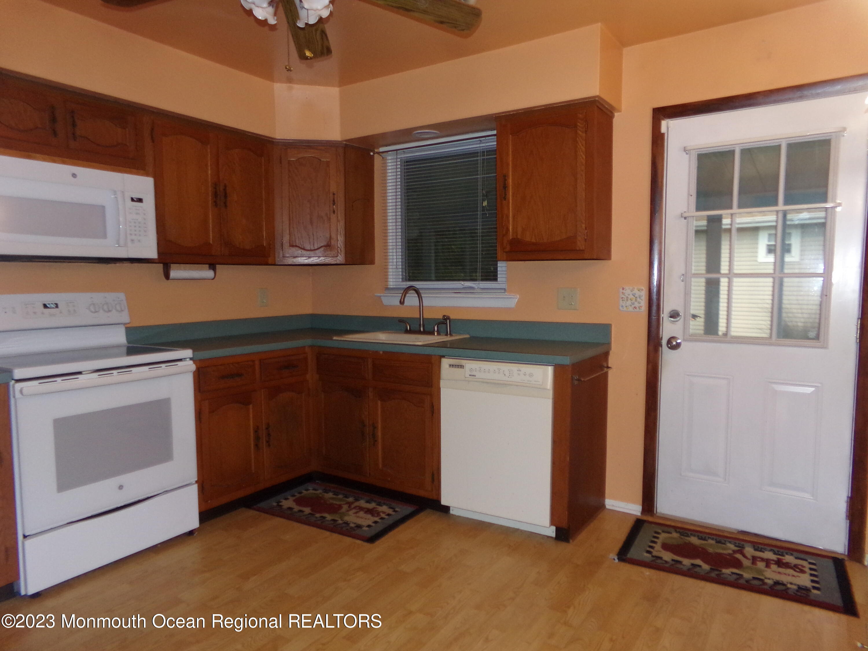 11 Ardmore Street, Unit 61 Whiting, NJ 08759 - Photo 9 of 34 a kitchen with a sink cabinets and window