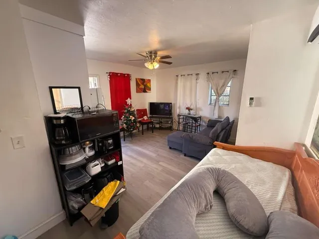 a bedroom with furniture and a window