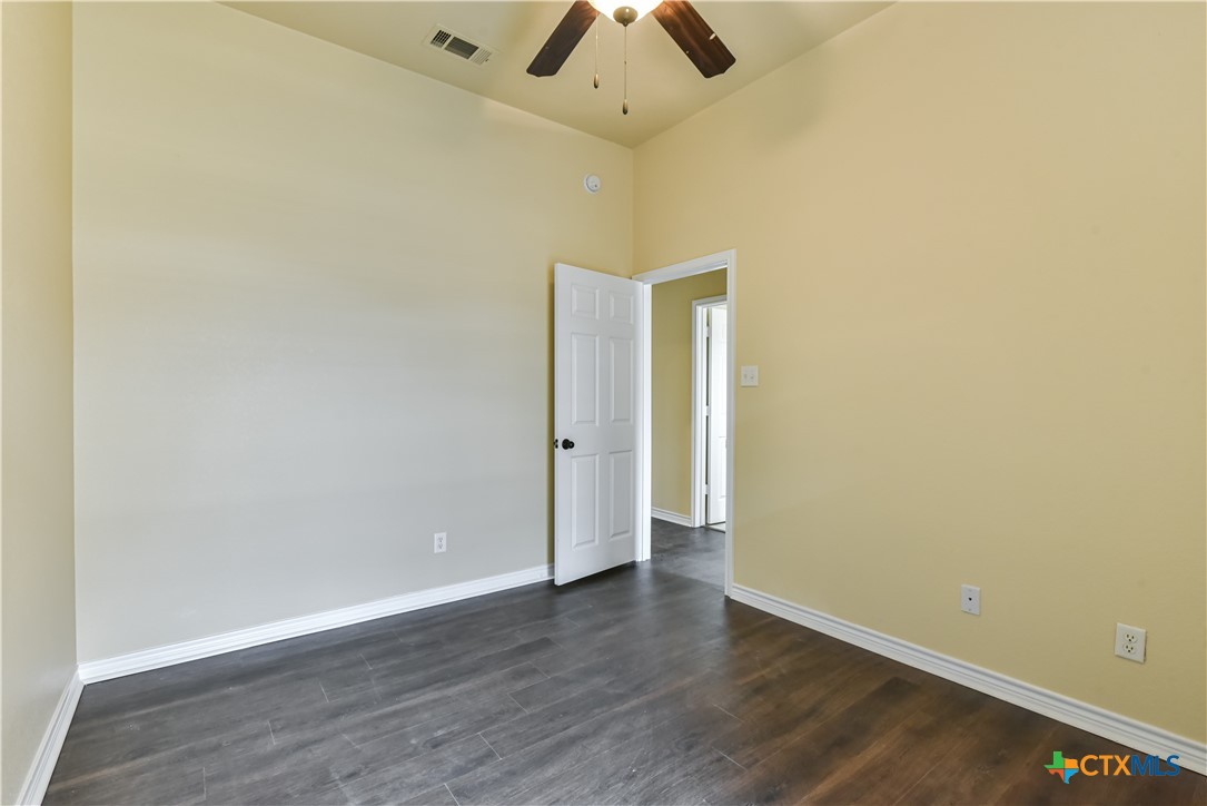 6905 Deorsam Loop Killeen, TX 76542 - Photo 14 of 21 an empty room with a empty space and a ceiling fan