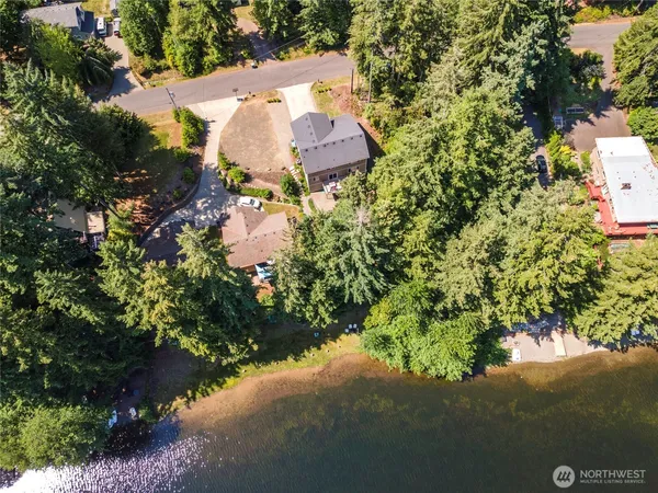 an aerial view of a house with yard and outdoor seating