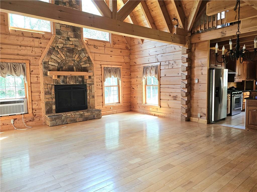 459 Big Knob Road Rochester, PA 15074 - Photo 14 of 48 a view of an empty room with exposed radiator and fireplace