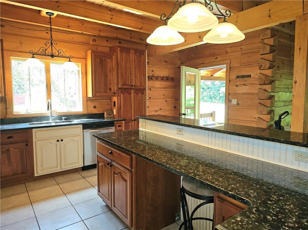 459 Big Knob Road Rochester, PA 15074 - Photo 19 of 48 a kitchen with stainless steel appliances granite countertop a sink and a cabinets
