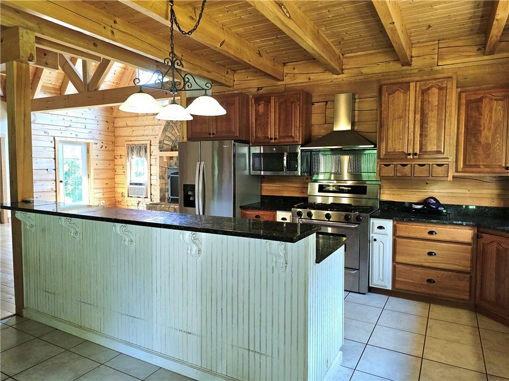 459 Big Knob Road Rochester, PA 15074 - Photo 20 of 48 a kitchen with stainless steel appliances granite countertop a refrigerator and a stove top oven