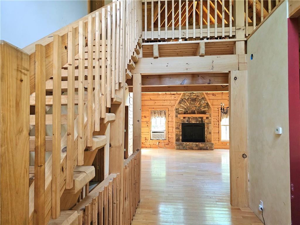 459 Big Knob Road Rochester, PA 15074 - Photo 9 of 48 a view of a hallway with wooden floor and a fireplace