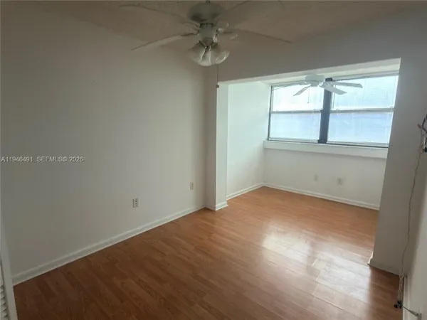 a view of a hallway with seating area