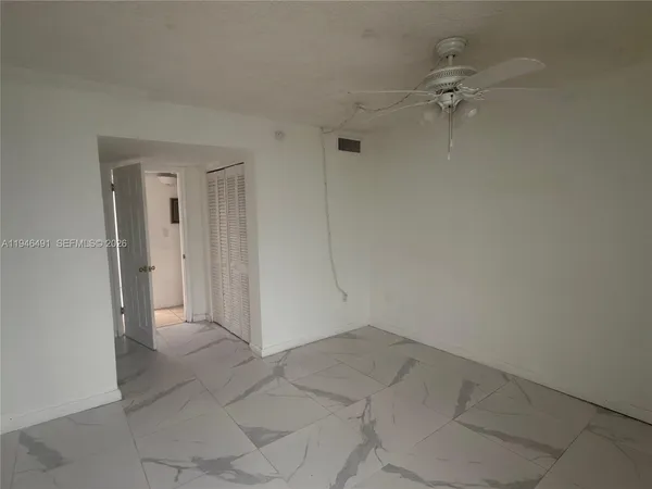 a view of a bathroom from a hallway