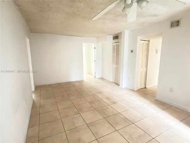 a view of an empty room and window