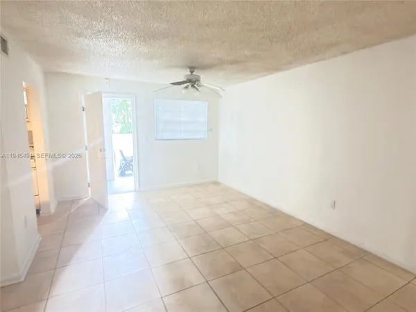 a view of empty room with a fireplace