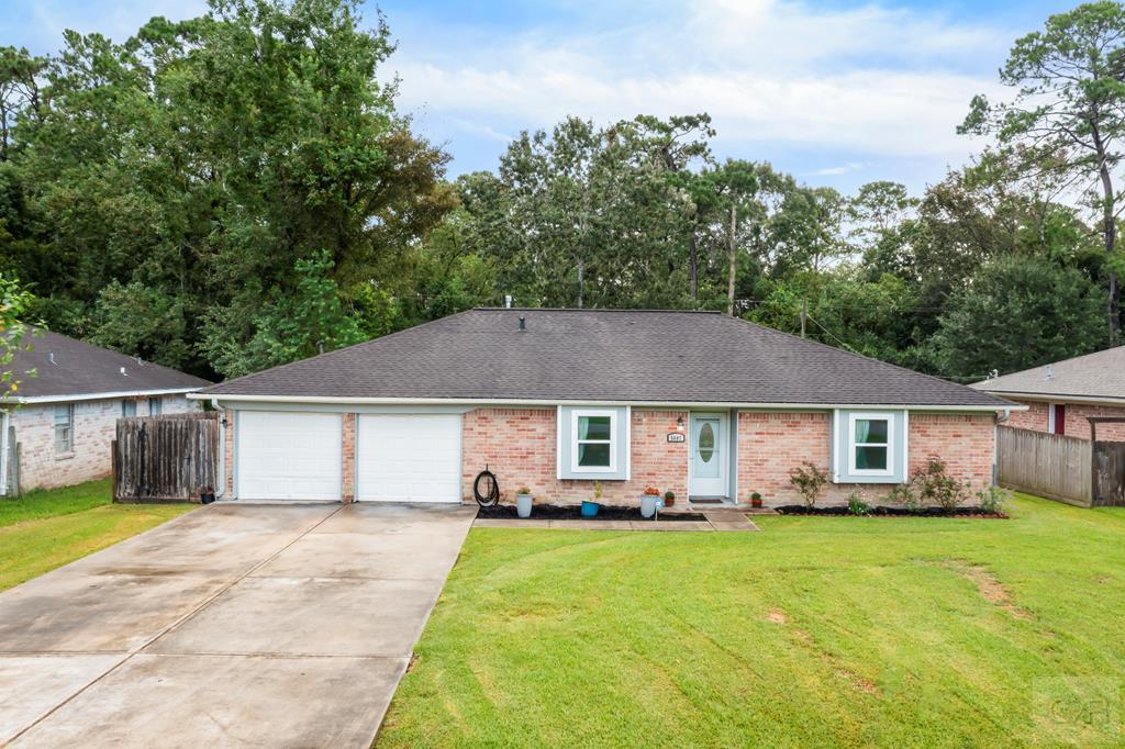 5607 Commodore Drive Dickinson, TX 77539 - Photo 1 of 23 a house view with a garden space