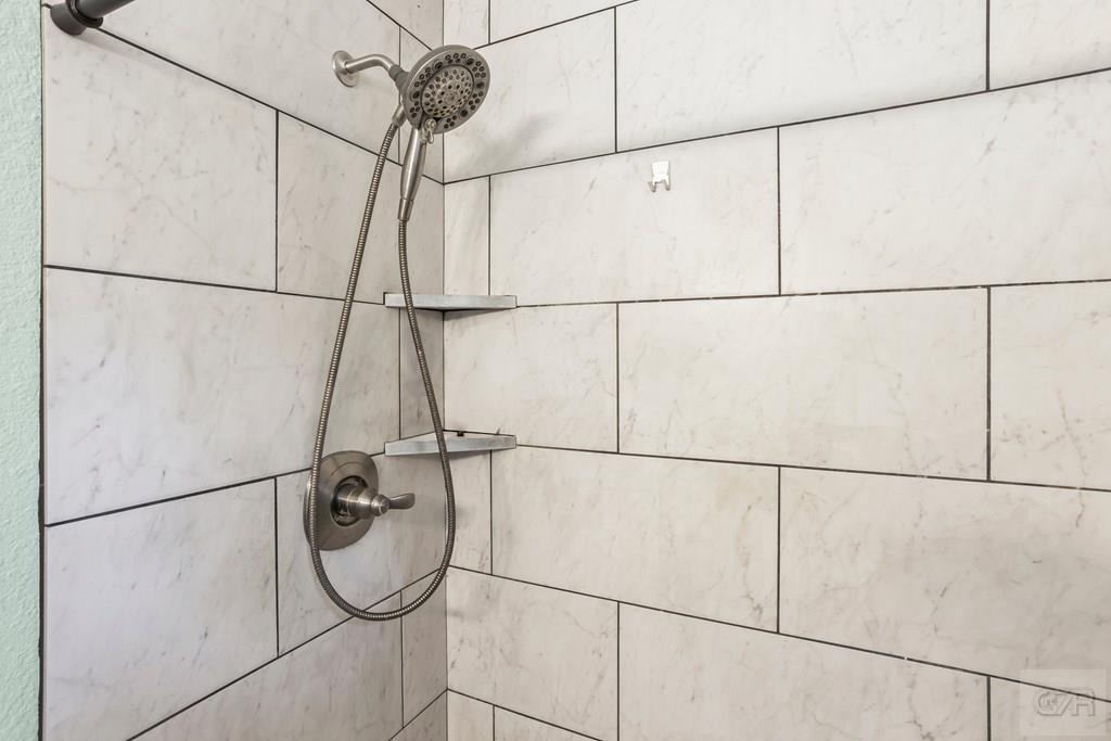 5607 Commodore Drive Dickinson, TX 77539 - Photo 13 of 23 a bathroom with a shower