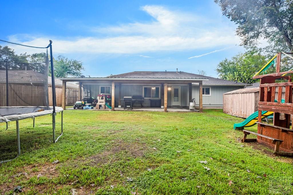 5607 Commodore Drive Dickinson, TX 77539 - Photo 18 of 23 a view of a house with a yard patio and swimming pool