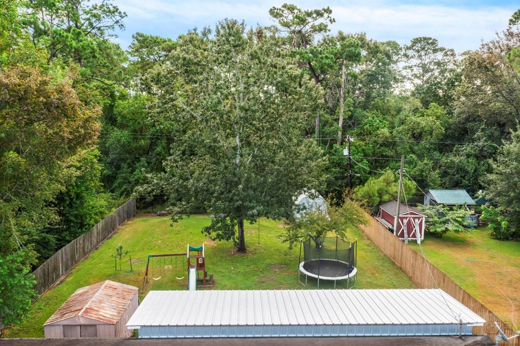 5607 Commodore Drive Dickinson, TX 77539 - Photo 20 of 23 a view of yard from deck with patio
