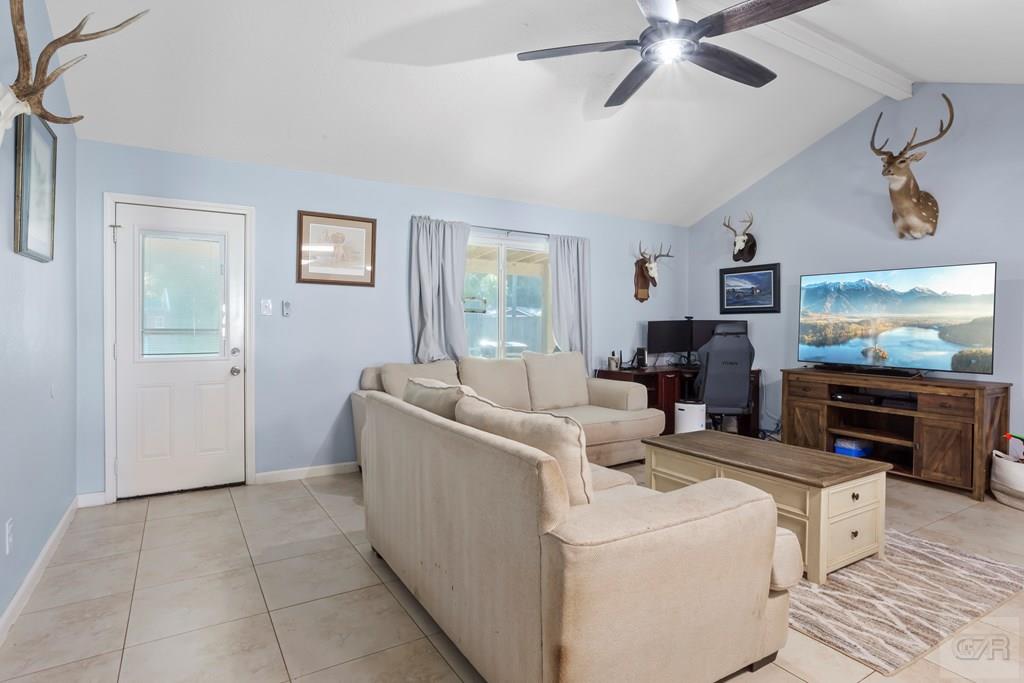 5607 Commodore Drive Dickinson, TX 77539 - Photo 5 of 23 a living room with furniture and a flat screen tv