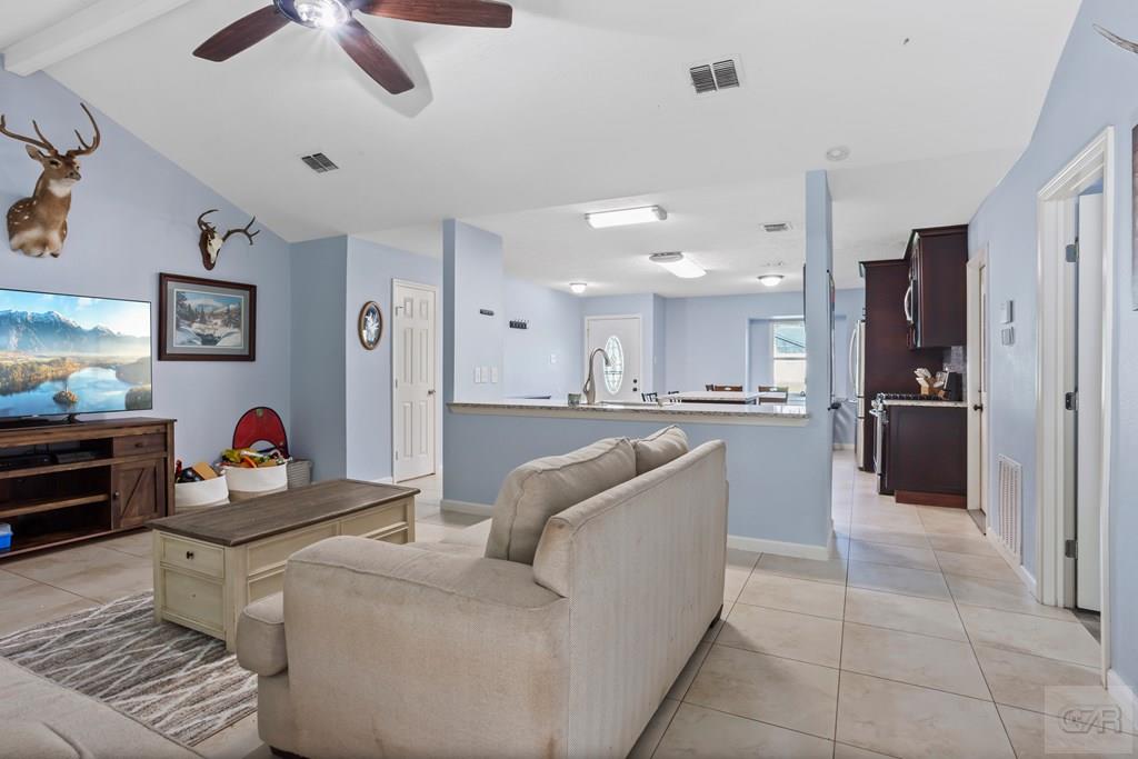 5607 Commodore Drive Dickinson, TX 77539 - Photo 6 of 23 a living room with furniture and kitchen view