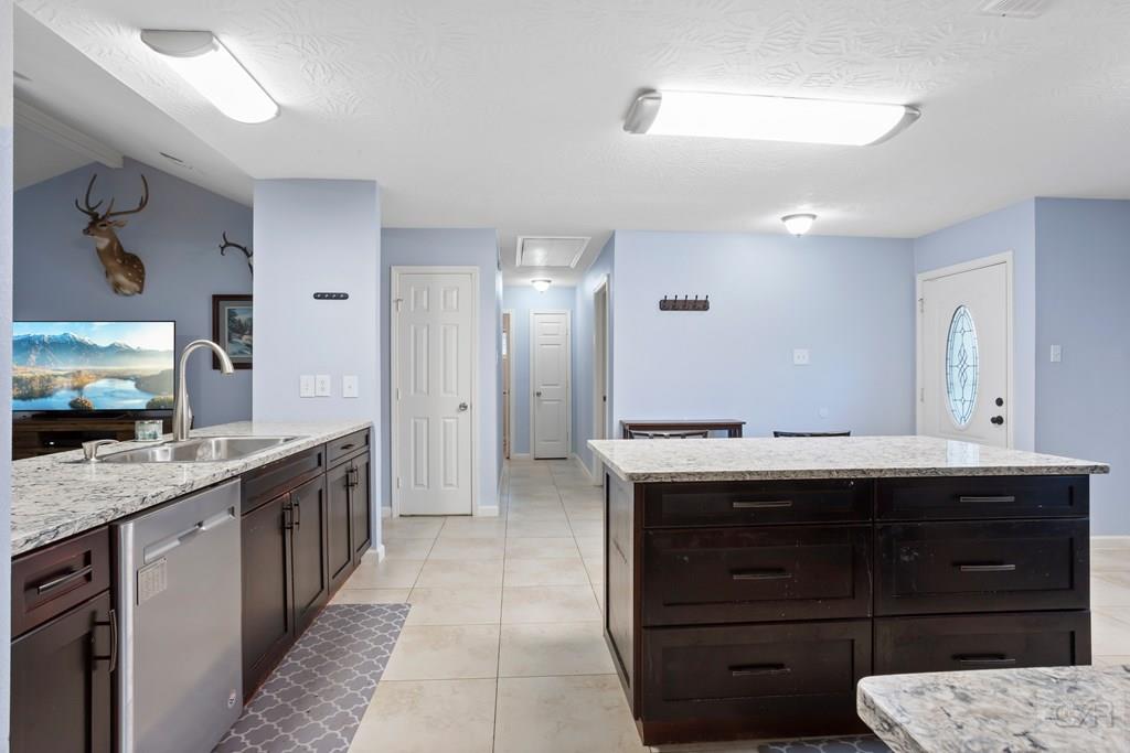 5607 Commodore Drive Dickinson, TX 77539 - Photo 8 of 23 a spacious bathroom with a granite countertop sink double vanity and mirror