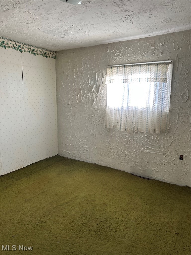 44952 Moose Ridge Road Woodsfield, OH 43793 - Photo 39 of 48 Bedroom with a textured wall and a textured ceiling