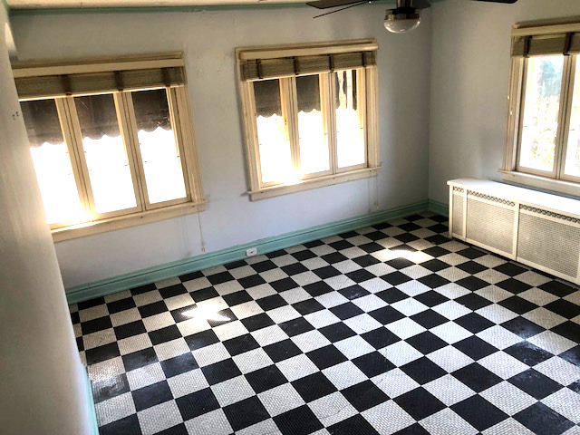 906 North Sheridan Road Waukegan, IL 60085 - Photo 17 of 34 a black and white checkered floor with a black white checkered floor