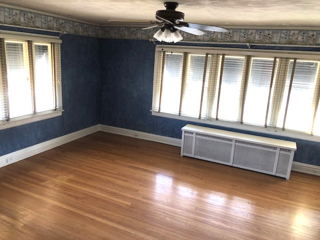906 North Sheridan Road Waukegan, IL 60085 - Photo 22 of 34 a view of an empty room with wooden floor and a window