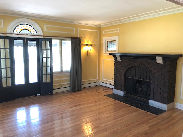 906 North Sheridan Road Waukegan, IL 60085 - Photo 5 of 34 a view of an empty room with window and fire place