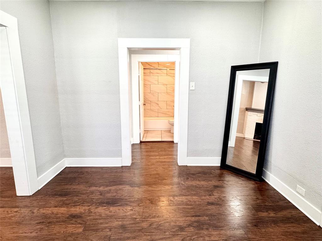 3455 Roberts Avenue Dallas, TX 75215 - Photo 12 of 25 an empty room with wooden floor and closet
