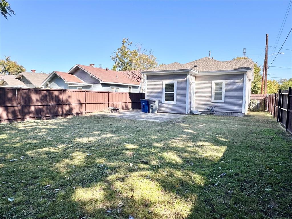 3455 Roberts Avenue Dallas, TX 75215 - Photo 24 of 25 a view of a yard in front of a brick house with large windows