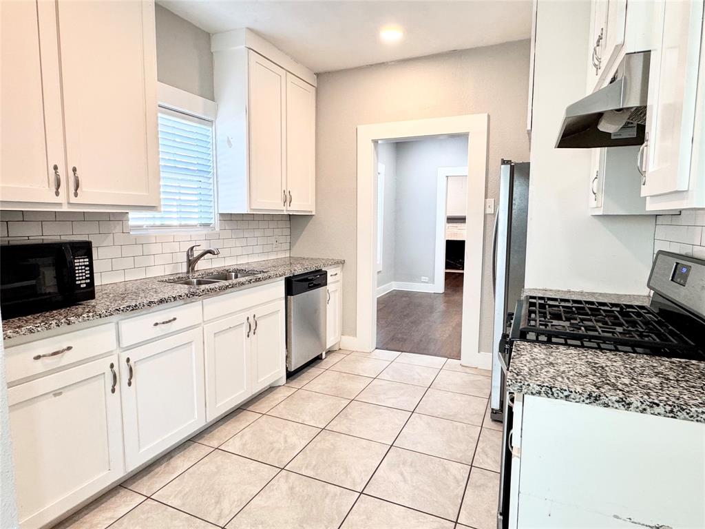 3455 Roberts Avenue Dallas, TX 75215 - Photo 4 of 25 a kitchen with a sink and cabinets
