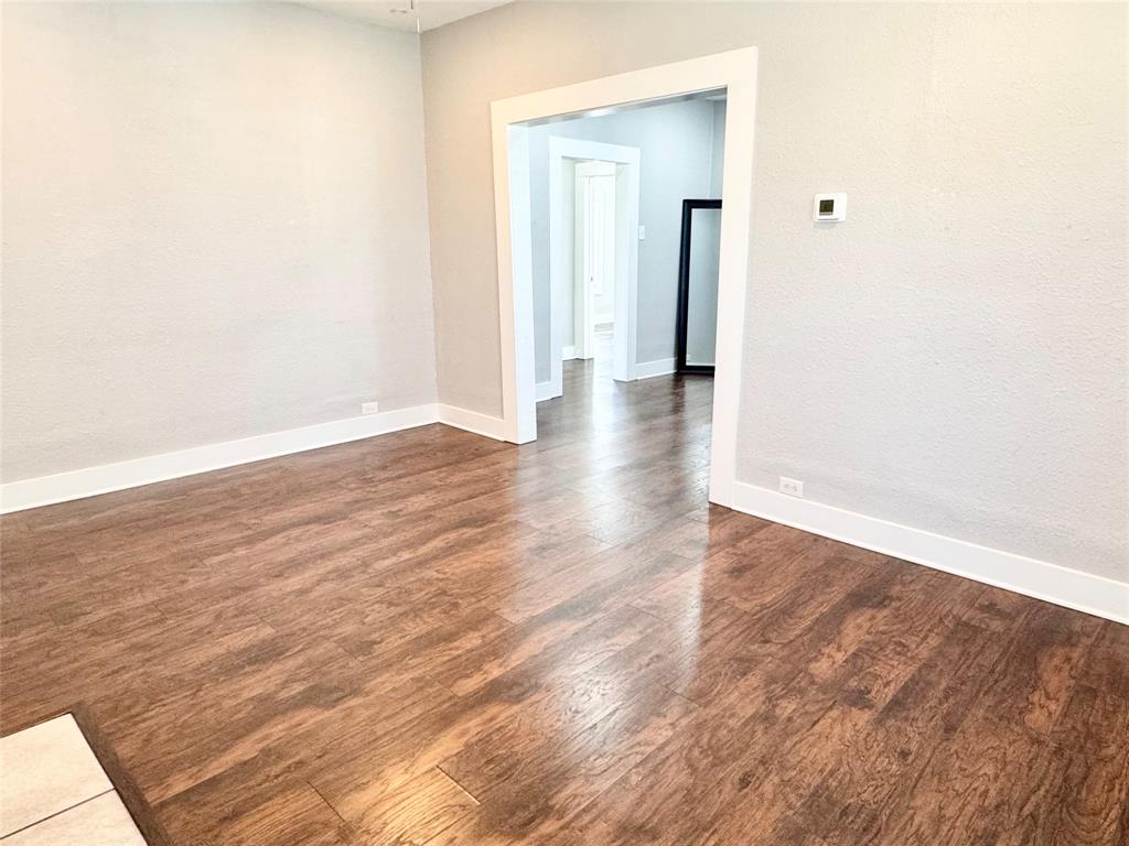 3455 Roberts Avenue Dallas, TX 75215 - Photo 10 of 25 a view of a hallway with wooden floor