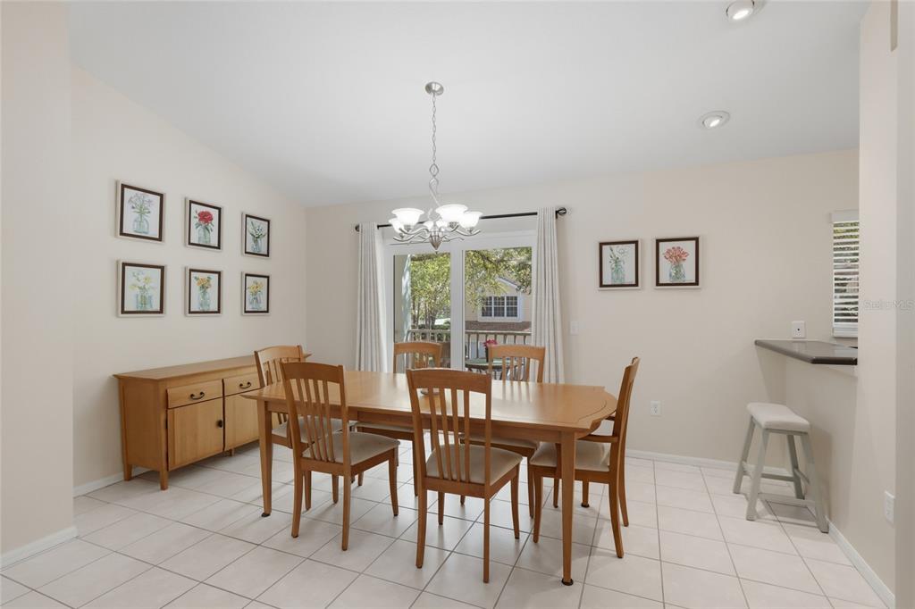 6406 Rosefinch Court, Unit 204 Lakewood Ranch, FL 34202 - Photo 12 of 36 a view of a dining room with furniture