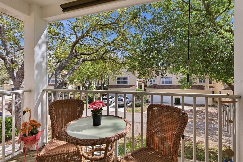 6406 Rosefinch Court, Unit 204 Lakewood Ranch, FL 34202 - Photo 14 of 36 a balcony with table and chairs