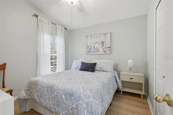 a bedroom with a large bed and a window