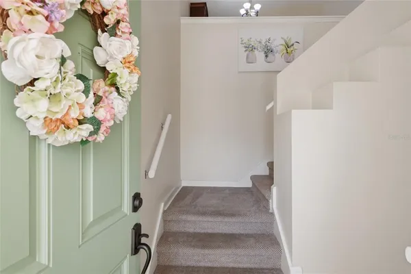 a view of staircase with white walls