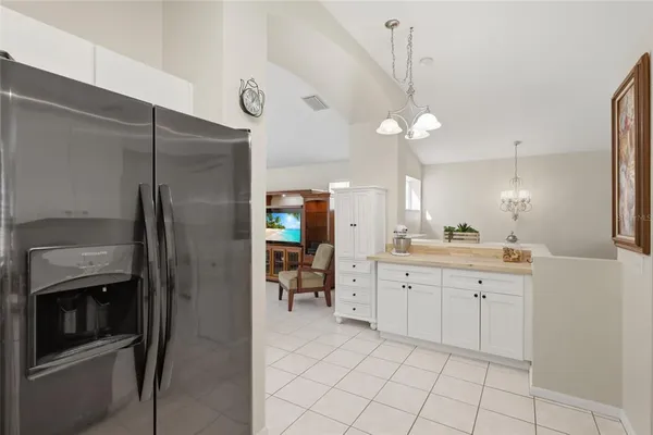 a kitchen with a sink and refrigerator