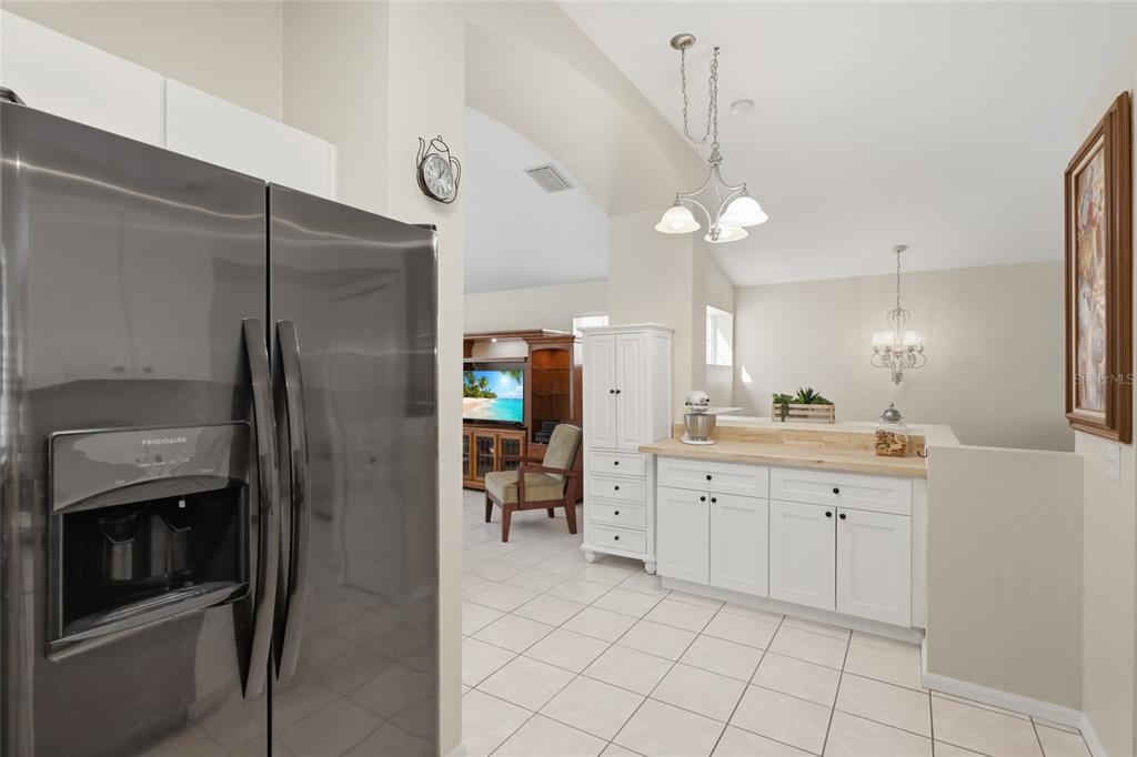 6406 Rosefinch Court, Unit 204 Lakewood Ranch, FL 34202 - Photo 7 of 36 a kitchen with a sink and refrigerator
