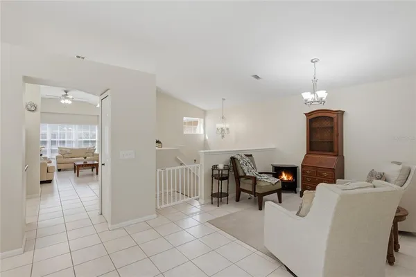 a living room with furniture a dining table and chairs