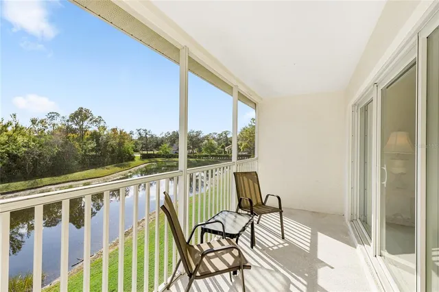 a view of balcony with wooden floor and outdoor seating