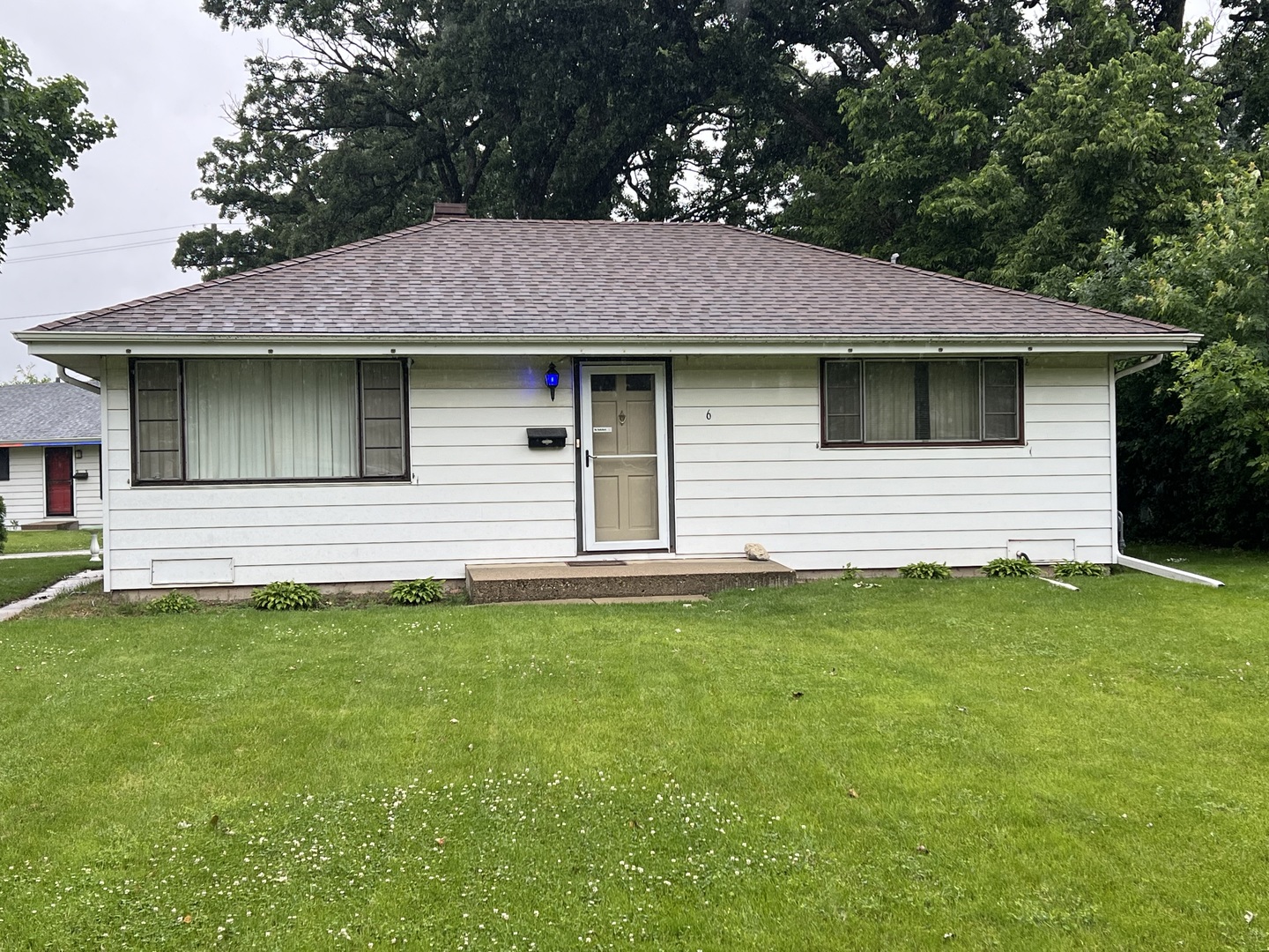 6 Manor Road Lake Zurich, IL 60047 - Photo 1 of 1 a front view of a house with a garden