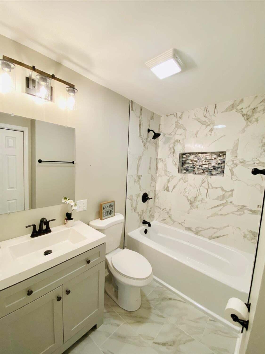 745 Juniper Road Valparaiso, IN 46385 - Photo 16 of 28 a bathroom with a toilet sink shower and bathtub