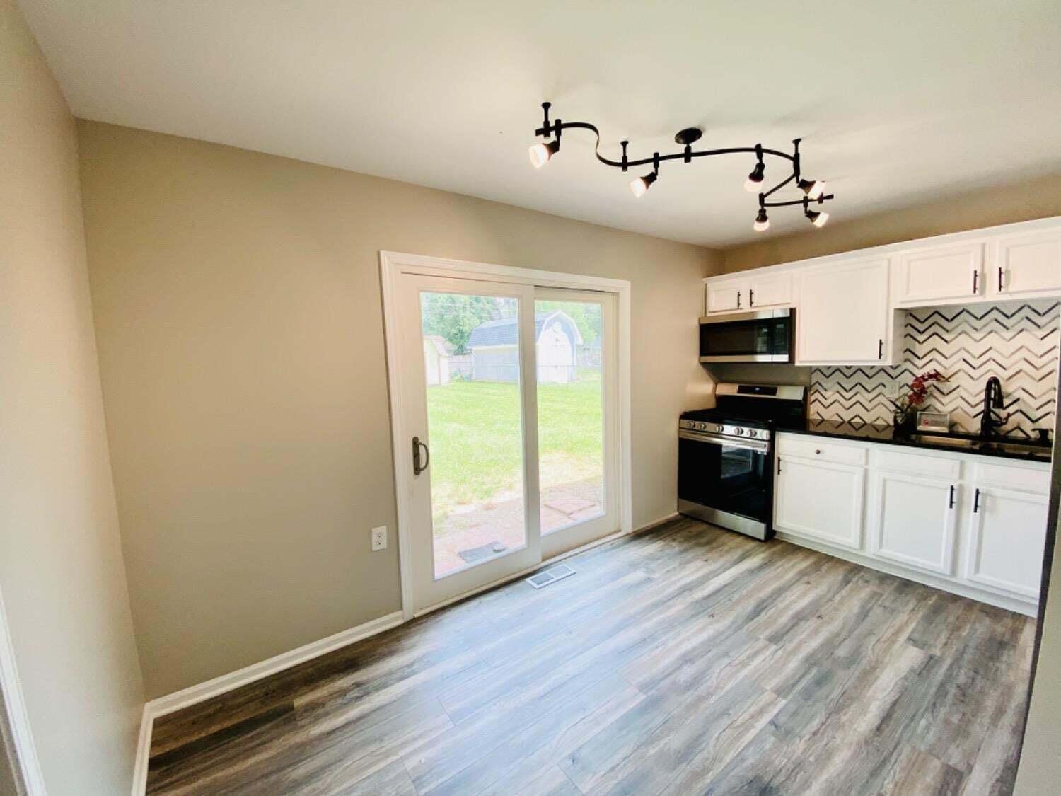 745 Juniper Road Valparaiso, IN 46385 - Photo 8 of 28 a kitchen with stainless steel appliances a stove top oven and sink