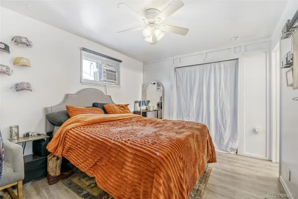 a bedroom with bed and a window