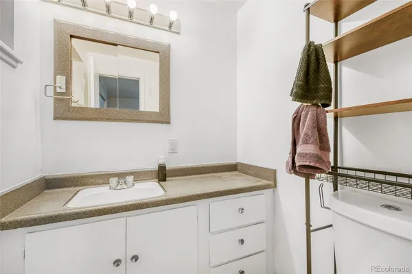 a bathroom with a sink and vanity